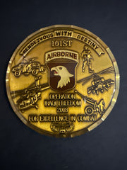 Gold military commemorative coin with engraved 101st Airborne and parachute wing, Operation Iraqi Freedom 2003, For Excellence in Combat on a black background