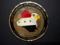 Decorative coin with eagle emblem, map of Iraq, and text on a dark background