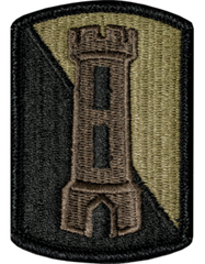 Patch with a castle design on a green and black background