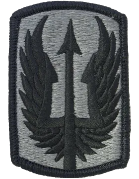 Military patch with a central emblem on a gray background