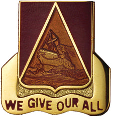 Pin with a triangle emblem and 'We Give Our All' text on a white background