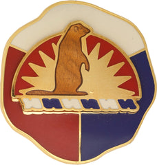 Metal pin, with a beaver in the middle and colored background