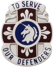 metal unit crest with a horse head emblem and text 'To Serve Our Defenders' on a silver metal background