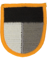 Patch with black, gray, white, and orange design on a white background