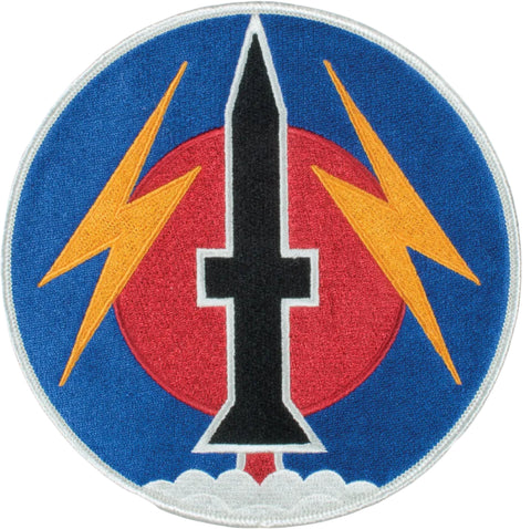 Circular embroider patch with a black knife symbol between two yellow lightning bolts on a blue background