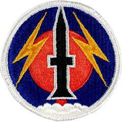 Circular embroider patch with a central knife design, flanked by two yellow lightning bolts on a blue background.