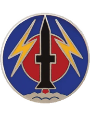 Circular metal pin with a black dagger between two yellow lightning bolts on a blue background