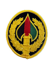 Embroidered patch with a circular design on a blue textured background