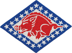 Embroidered patch with a red pig design on a blue background with white stars.