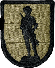 Black minute man figure embroider in black on a OCP green background embroider patch