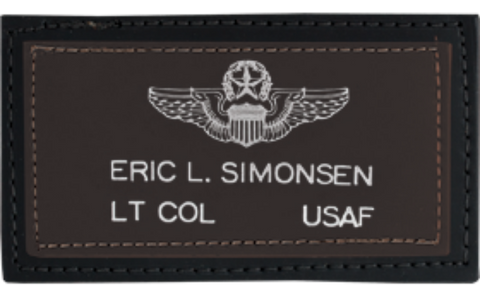 Printed  leather name tag patch with military insignia and text on a brown background