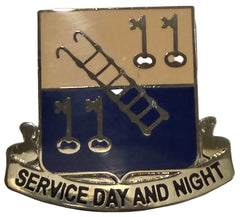 Metal Unit Crest with ladder, keys, and 'Service Day and Night' text on a beige and blue background