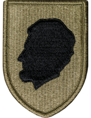 Patch with a black silhouette of a head on a green background