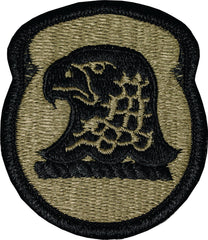 Embroidered patch with an eagle design on a green background