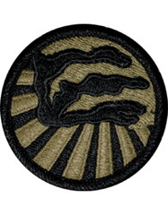 Circular patch with a black silhouette of a panther and gold rays on a white background