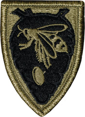 Embroidered patch with a design of a lion and olive branches on a green background