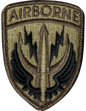 Airborne patch with a bullet and wings design on a brown background