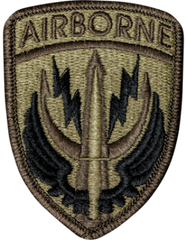 Airborne patch with a bullet and wings design on a brown background
