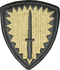 Military embroidered patch with a shield design and central sword on a white background