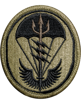 Circular military patch with a design of a parachute and wings on a beige background