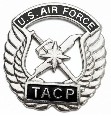 U.S. Air Force TACP metal badge on a silver metal
