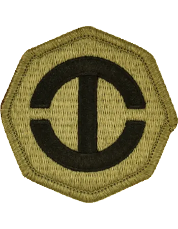 Hexagonal patch with a black symbol on a beige background