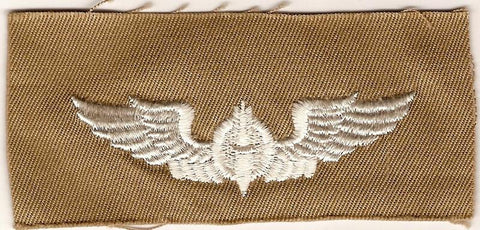 Army Bombardier wing in tan sew on cloth.
