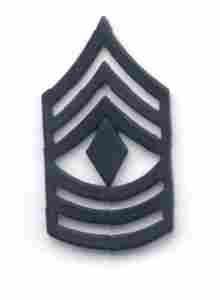 First Sergeant rank insignia in black subdued metal.